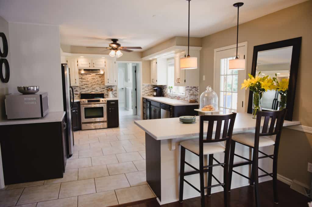 before and after kitchen photos. two tone painted cabinetry