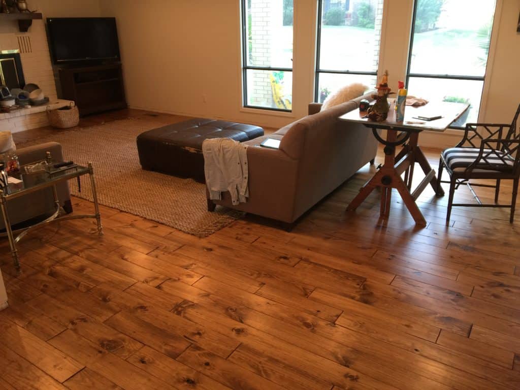 Minwax Early American stain on Pine.  Solid Hardwood flooring in Kitchen