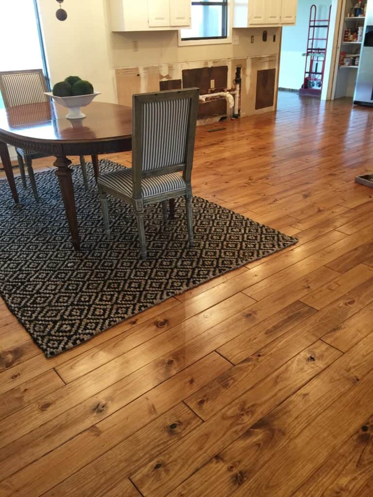 Minwax Early American stain on Pine.  Solid Hardwood flooring in Kitchen