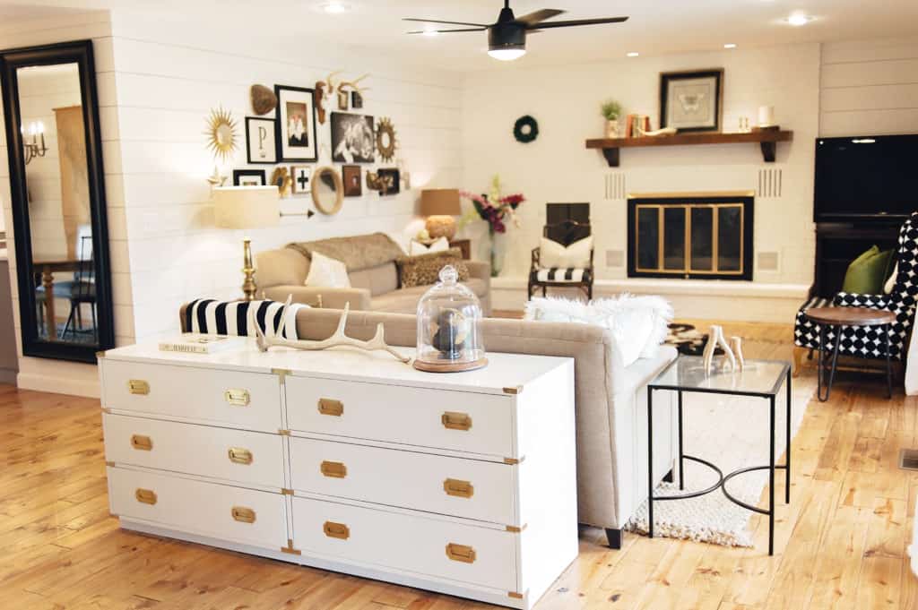 Light and airy updated living room adorned in shiplap makes for a modern farmhouse retreat.