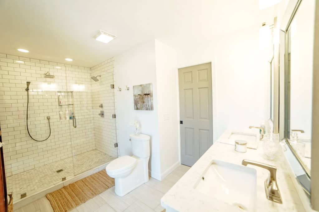 This gorgeous master bathroom features a huge subway tile walk-in shower you'll have to see to believe! 