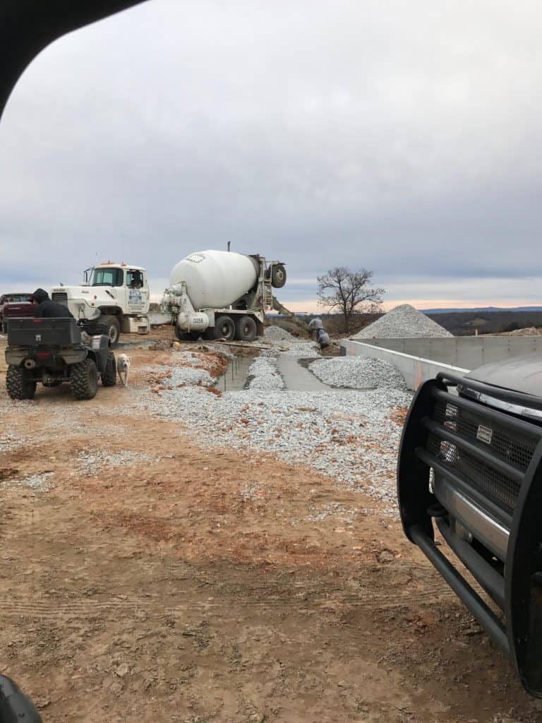 Concrete truck pouring footers for new construction