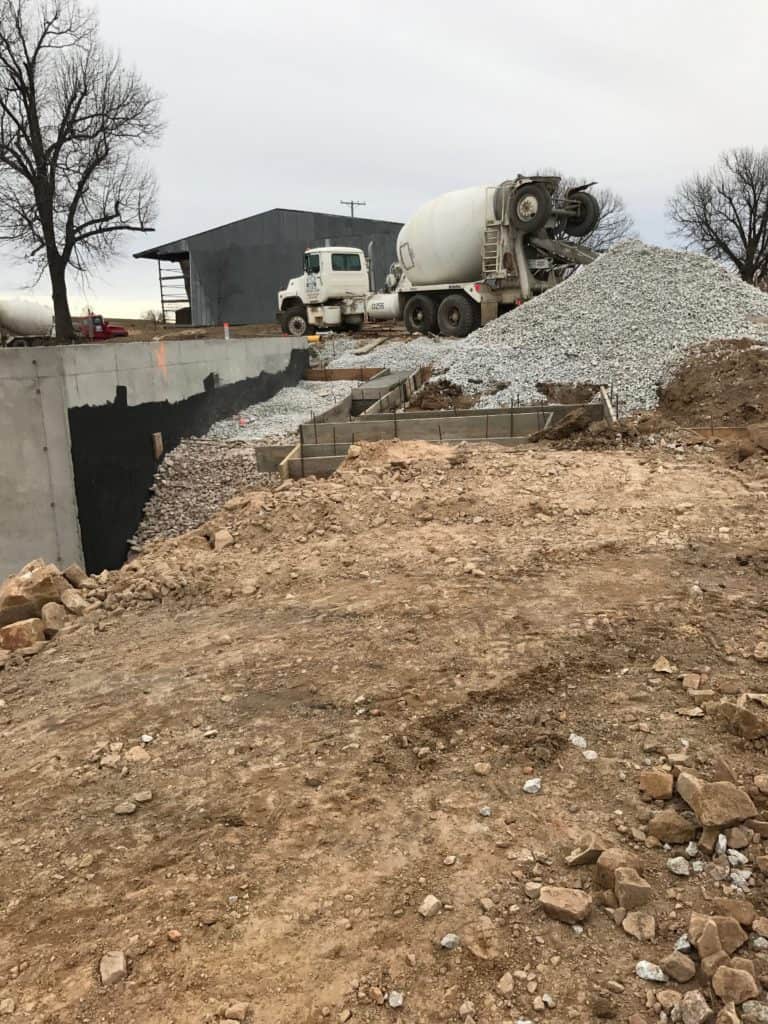 Concrete truck pouring footers for new construction