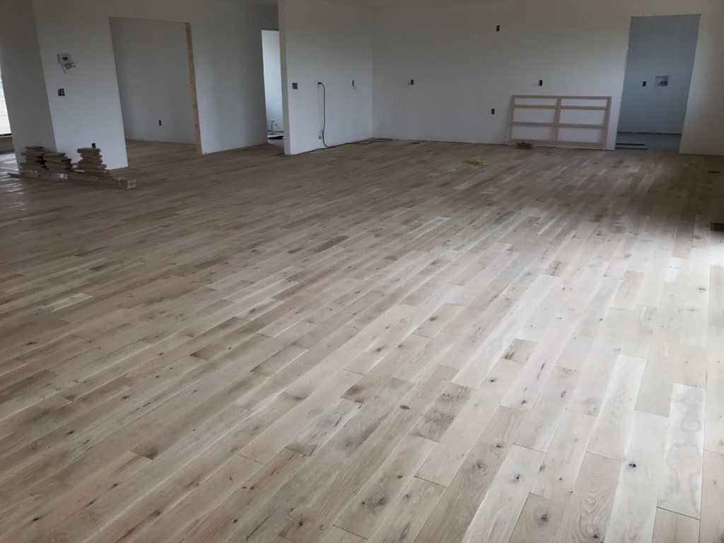 We chose #2 wide plank solid White Oak hardwood for the main level of the house.