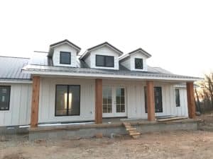 Cedar porch posts on modern farmhouse.