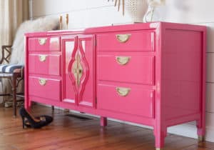 Pink lacquered dresser with brass hardware