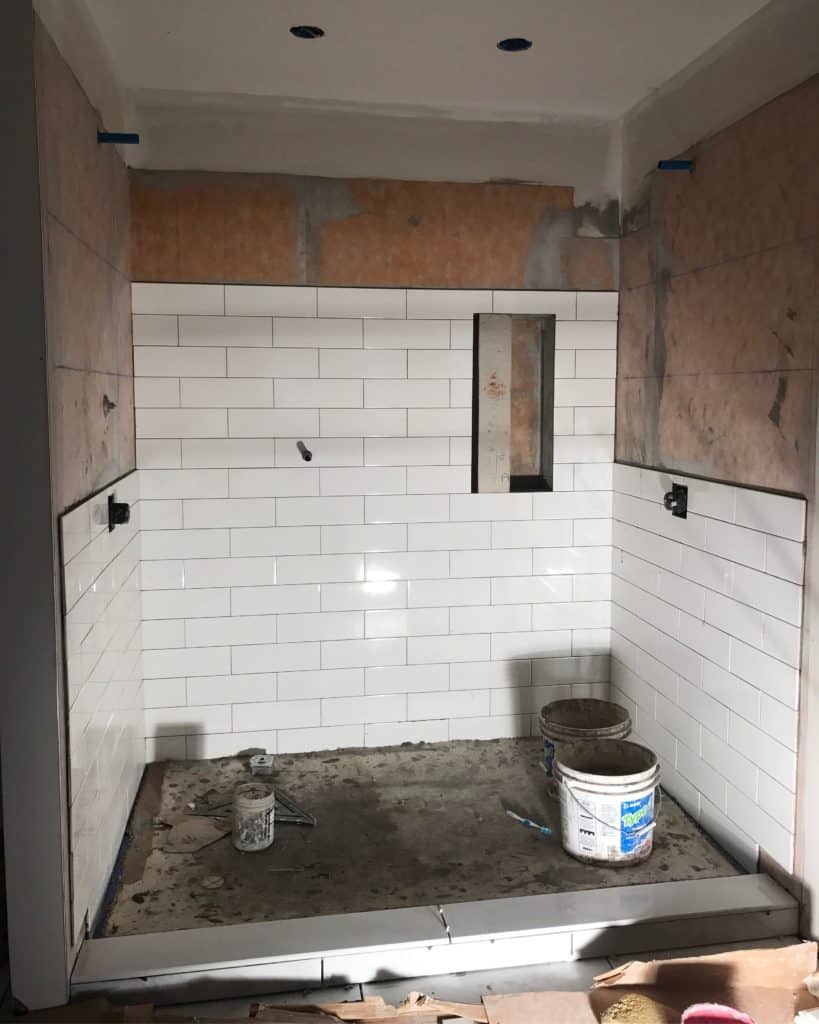 4'x12" white subway tile shower walls.