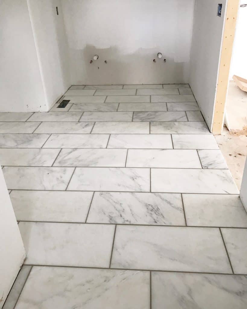 12"x24" marble tile on bathroom floor.