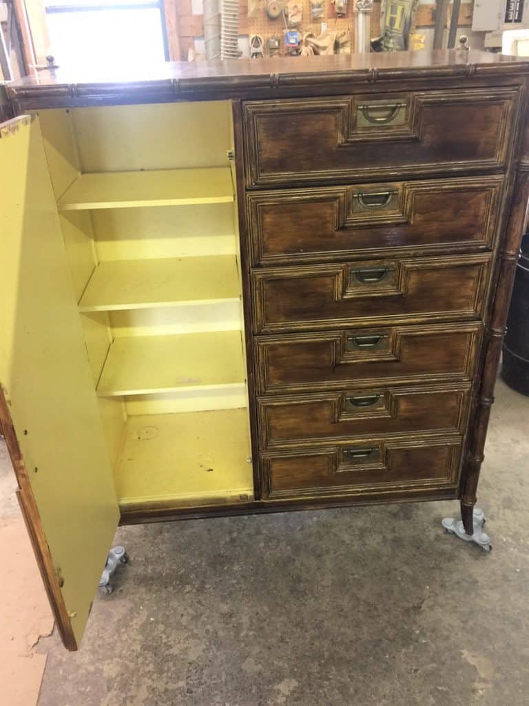 The inside cavity of the dresser is all that remained of the original, factory yellow finish on this Stanley faux bamboo dresser. The outside of the piece had been stained darker to look like wood using a gel stain.