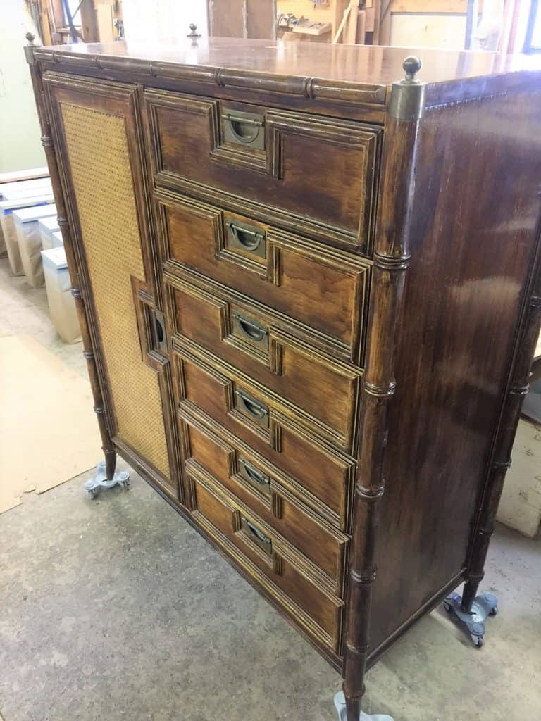Side view of Stanley faux bamboo campaign chest of drawers. All of the original brass campaign hardware was intact.