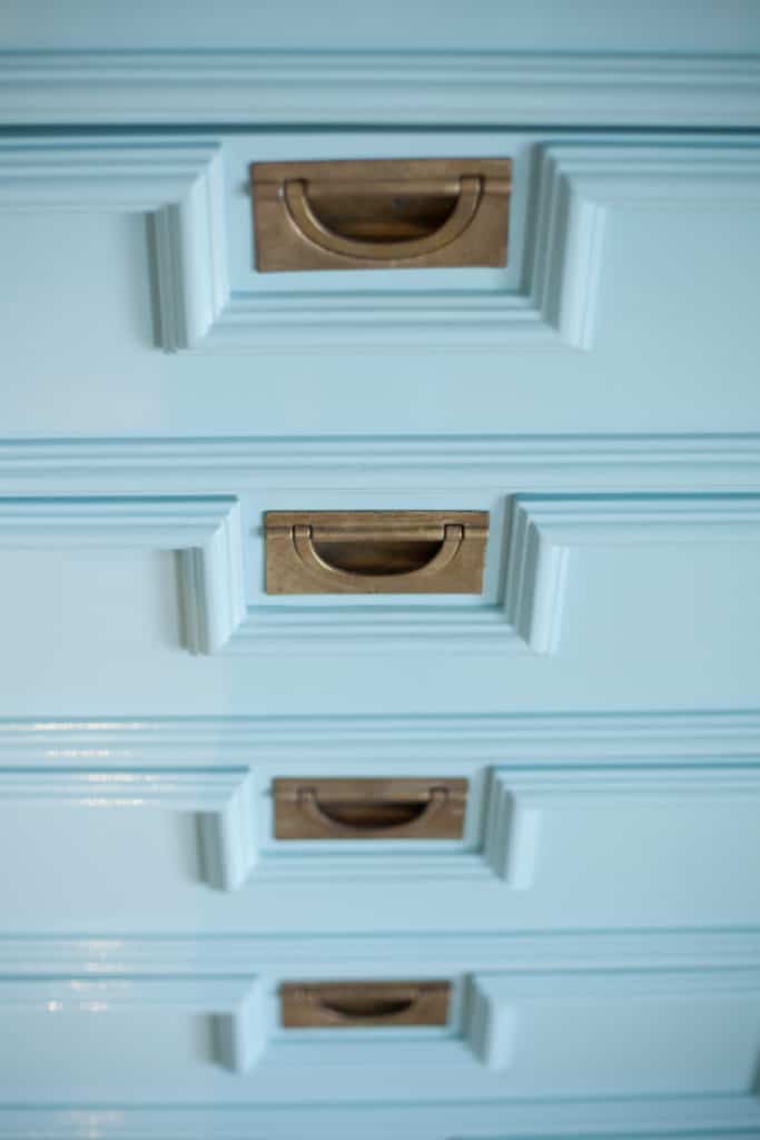 Who absolutely loves brass campaign hardware as much as I do? Check out the beautiful pulls on this faux bamboo armoire. 