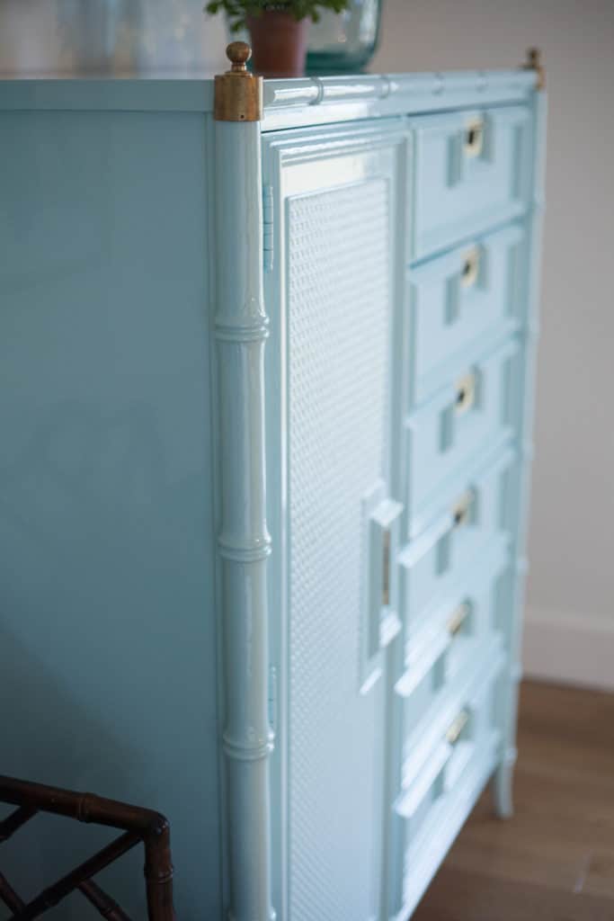 You will love the way light reflects off of this glossy painted faux bamboo chest of drawers. Take a look at how this dresser looked before its glossy makeover, you won't believe it!