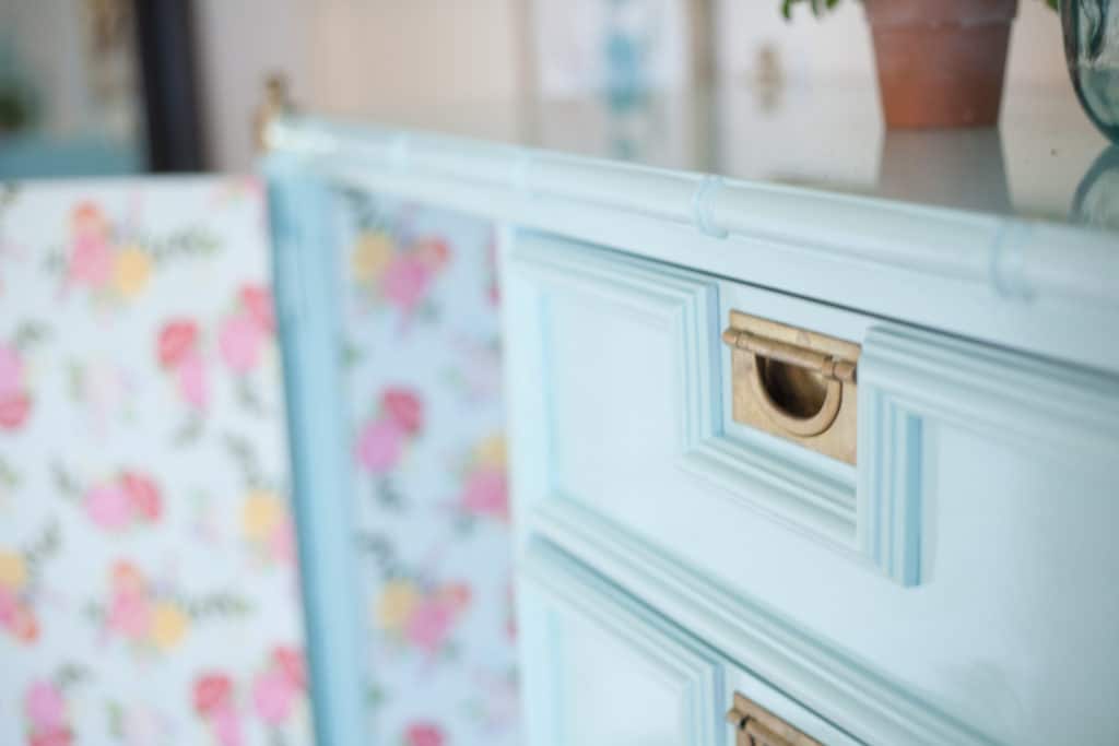 You won't believe how ugly this piece of furniture started out! Stunning before and after pictures of this glossy faux bamboo chest of drawers will make you swoon!