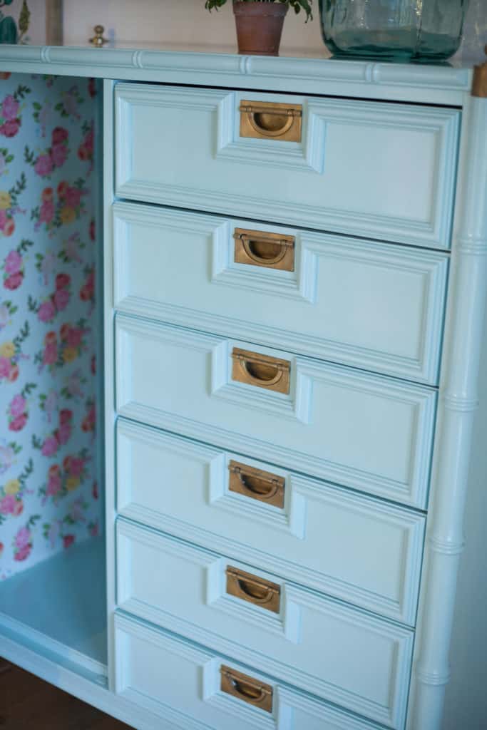 How I transformed an ugly piece of furniture into this gorgeous chest of drawers with paint, paper, and mod podge!