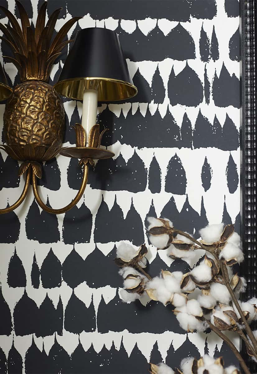 Schumacher's Queen of Spain wallpaper in black and white is utterly stunning in this powder bathroom.