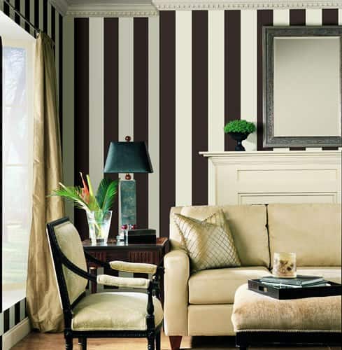 Chic living room with bold black and white striped wallpaper.