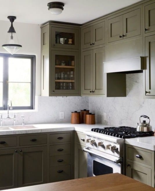 Gorgeous Olive cabinetry feels modern and fresh paired with black hardware.