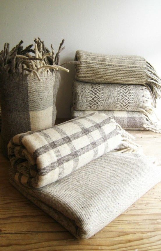 Wonderfully cozy wool blankets in classic gray and cream tartan.