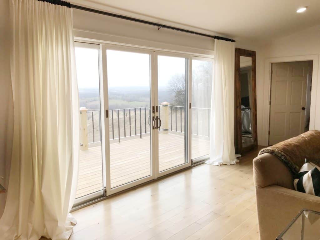 Andersen sliding patio doors. Ikea Ritva curtains in white