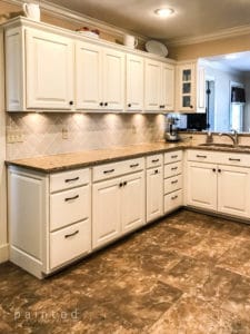 Painting these oak cabinets brightened up the is kitchen!
