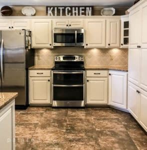 Sherwin Williams Aria Ivory updates these Oak cabinets.