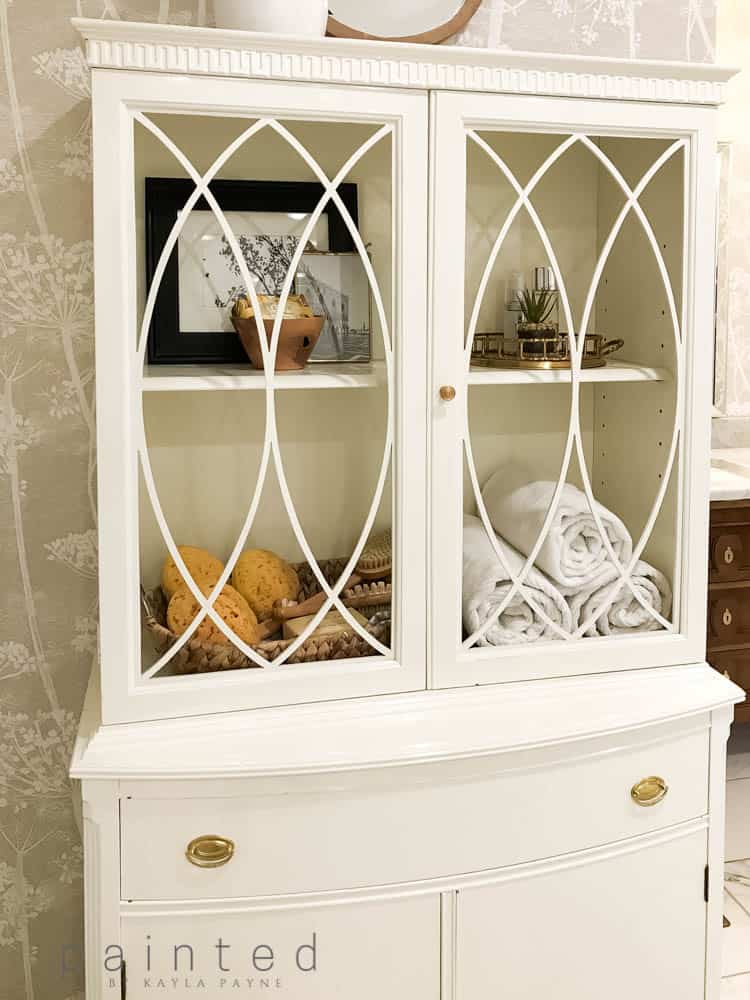 Antique cabinet for storage in master bathroom