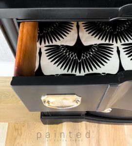 Modern black china cabinet. small black painted hutch. how to put wallpaper in furniture. how to paint furniture black. best black paint for furniture. lining drawers with fabric. how to line dresser drawers with fabric. Genevieve Gorder fabric. Black and white bird wallpaper. black and white bird fabric. flock onyx fabric by genevieve gorder.
