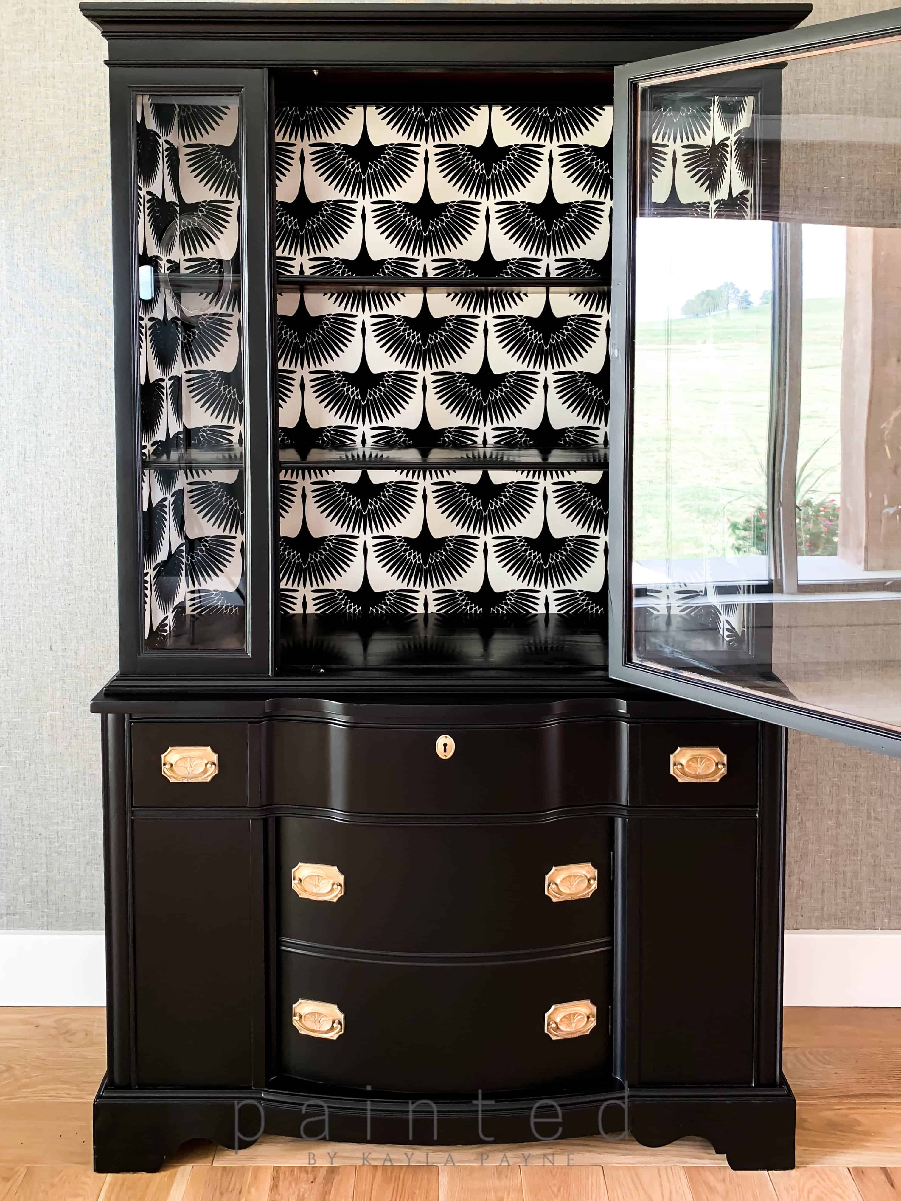 Modern black china cabinet. small black painted hutch. how to put wallpaper in furniture. how to paint furniture black. best black paint for furniture