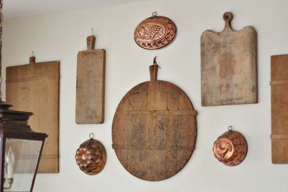 Unique kitchen decor ideas. farmhouse kitchen decorations. using antique bread boards as wall decor.