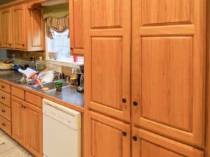 It's true, not everyone wants white kitchen cabinets! See how these dated 90's oak kitchen cabinets got a modern update with General Finishes Dark Chocolate Milk Paint