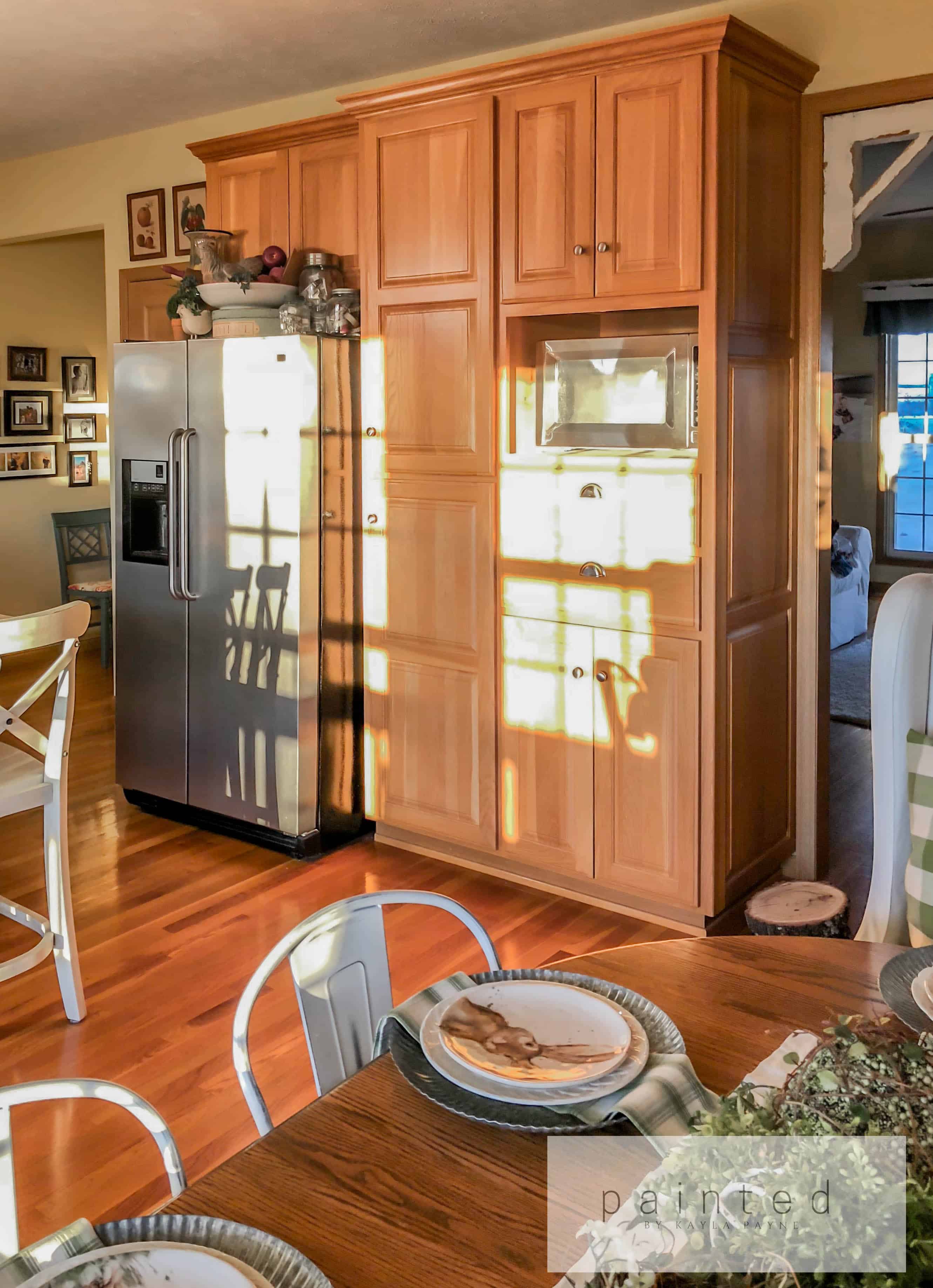 From Oak to Alabaster! This farmhouse kitchen receives a cabinet facelift with Sherwin Williams Alabaster.