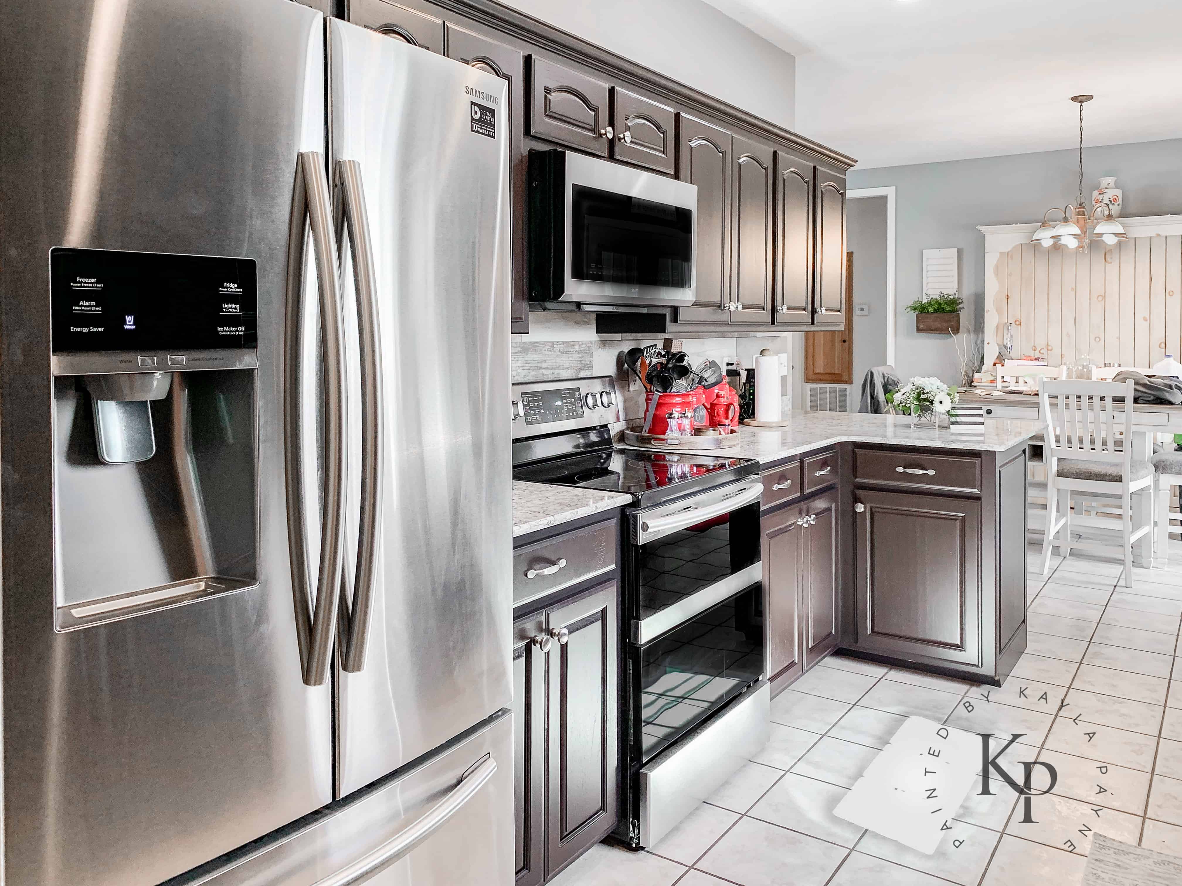 Dark kitchen cabinets and light granite counters. It's true, not everyone wants white cabinets!
