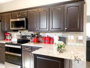 Dark kitchen cabinets with light granite countertops. Not everyone wants a white kitchen!