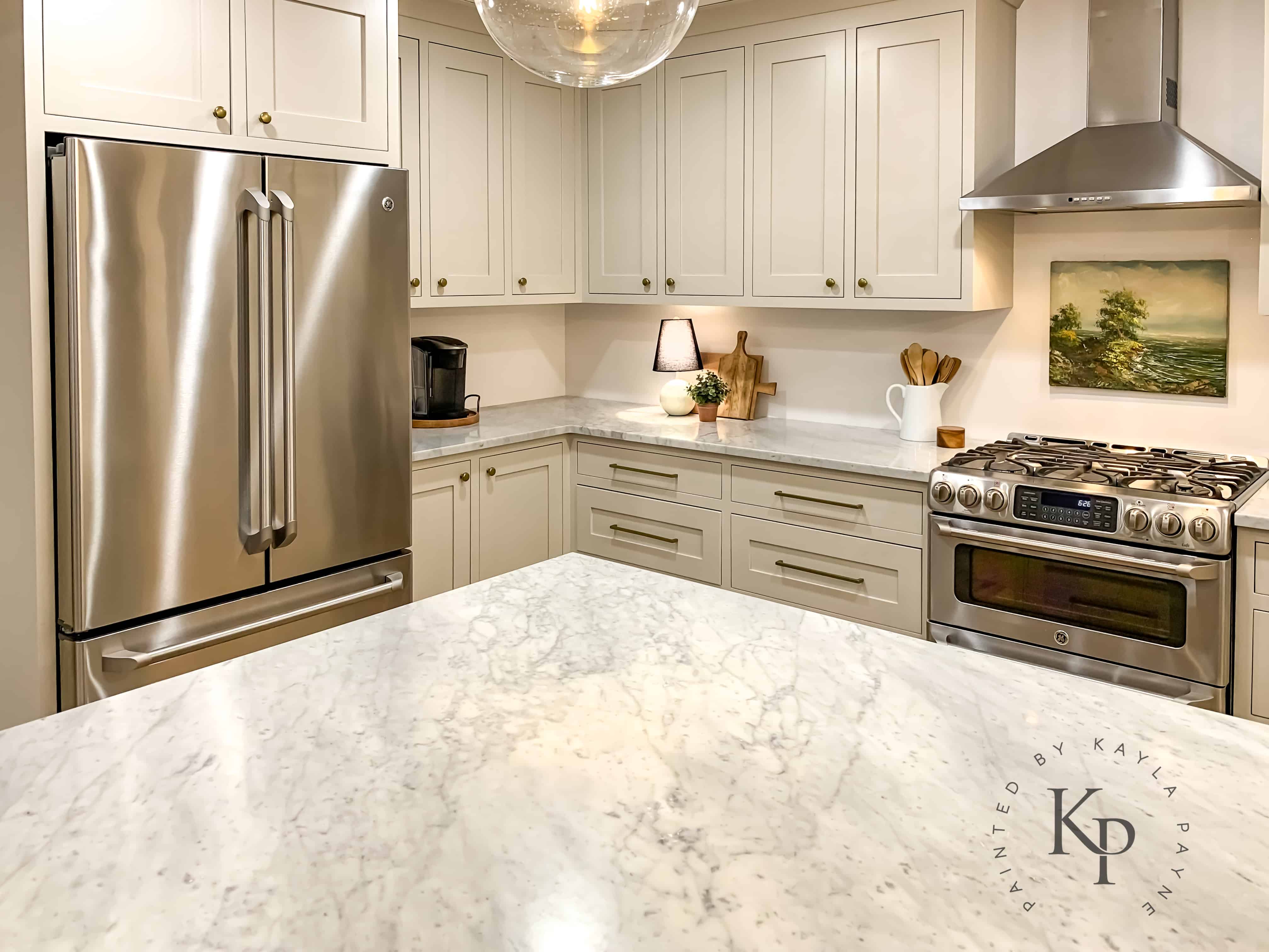 Carrara marble countertops in kitchen with revere pewter painted cabinets