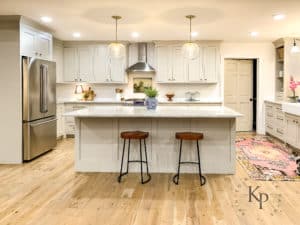 Open concept kitchen with Benjamin Moore Revere Pewter cabinets. White Oak hardwood floors stained in Minwax Weathered Oak.