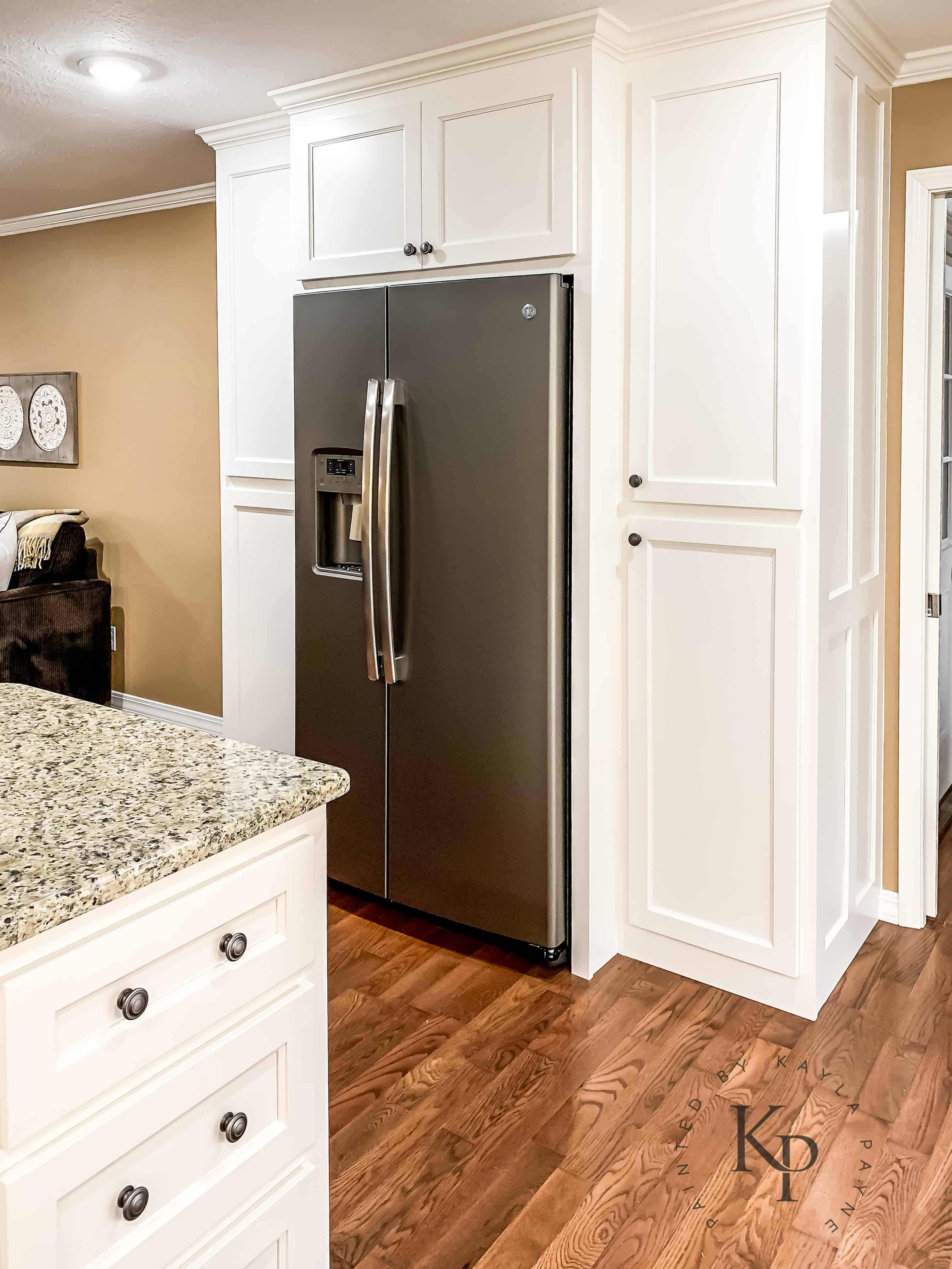 Kitchen layout ideas, Pantry built around the fridge. Kitchen cabinets painted in Sherwin Williams Dover White