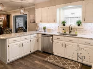 Kitchen Cabinets painted in sherwin williams alabaster with granite countertops