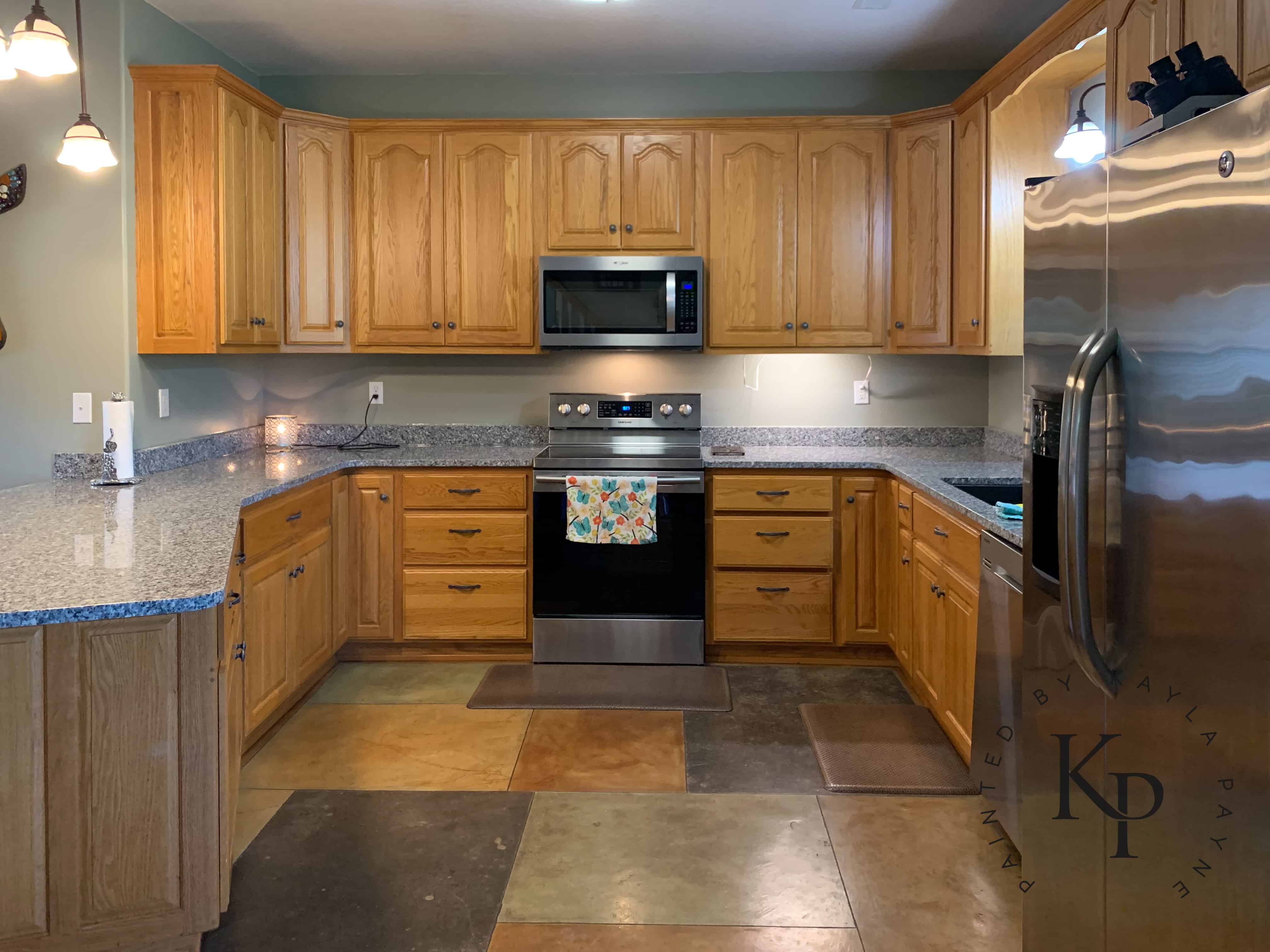 white painted wall with oak cabinet in kitchen