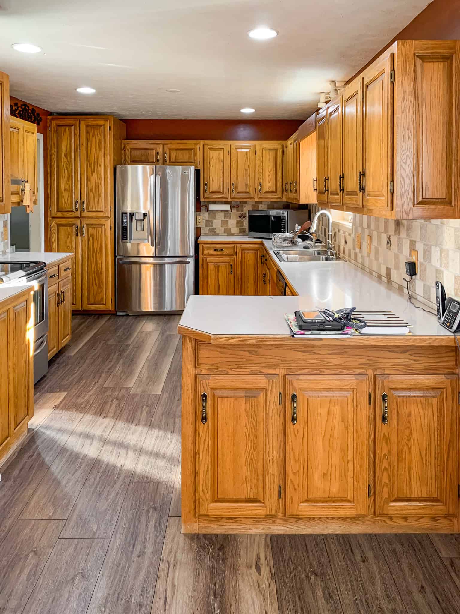 Wooden flooring kitchen with honey oak cabinets