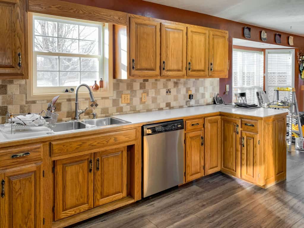 white painted wall with oak cabinet in kitchen