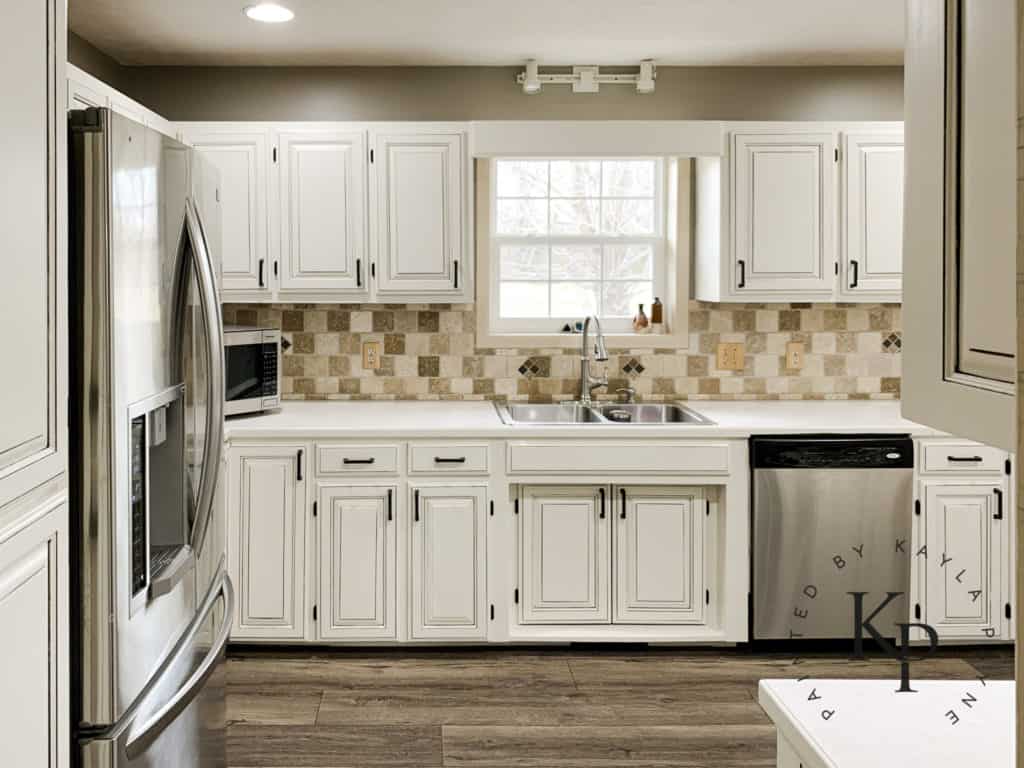 Gorgeous white kitchen cabinets with gray glaze Kitchen Cabinets Painted In Neutral Ground By Kayla Payne