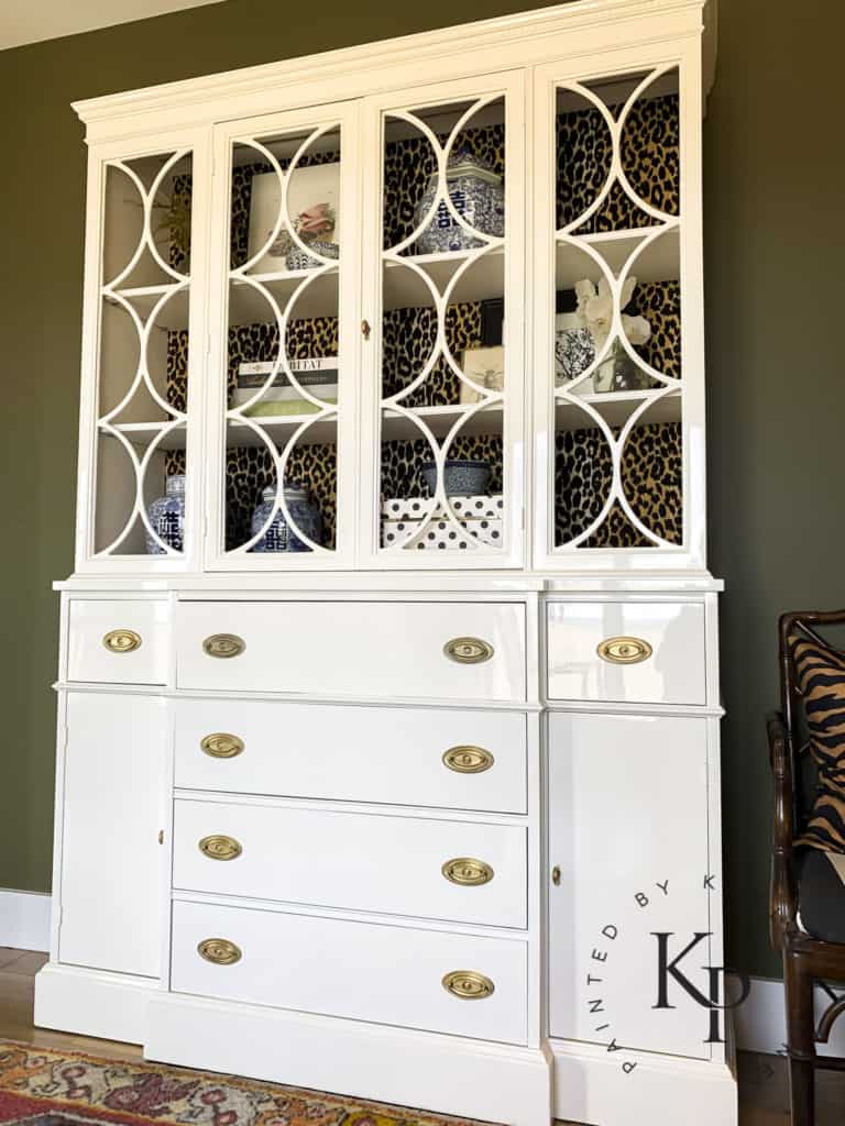 antique china cabinet, cabinet with circle fretwork, circular fretwork, white painted china cabinet, how to paint a china cabinet, how to brush high gloss on furniture, best gloss furniture paint, how to get glossy furniture