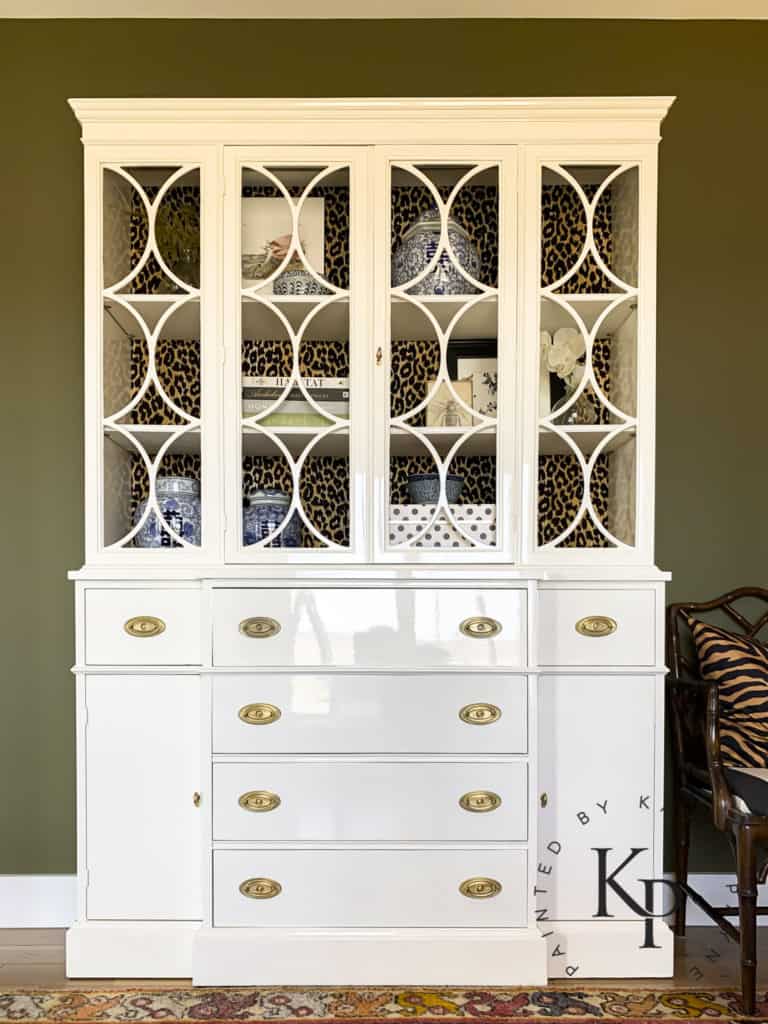antique china cabinet, cabinet with circle fretwork, circular fretwork, white painted china cabinet, how to paint a china cabinet, how to brush high gloss on furniture, best gloss furniture paint, how to get glossy furniture