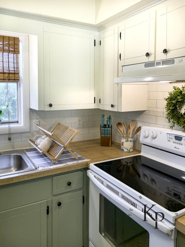 two tone cabinets, green lower cabinets, before and after kitchen photos