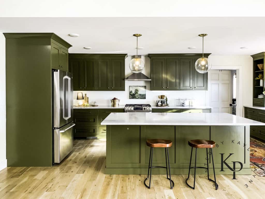 Dark green painted kitchen cabinets