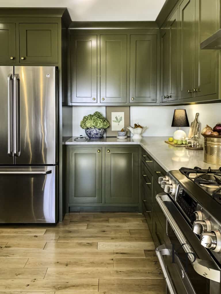 Green kitchen cabinets in Sherwin Williams Palm Leaf