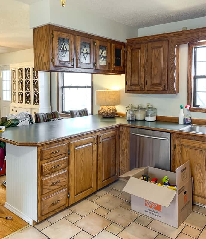 brown wood cabinets with stained glass in doors