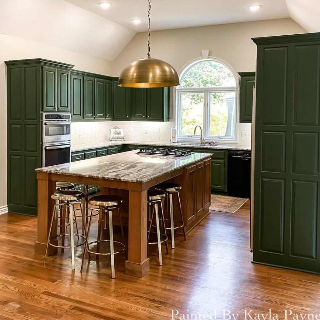 dark green kitchen cabinets painted in sherwin williams secret garden