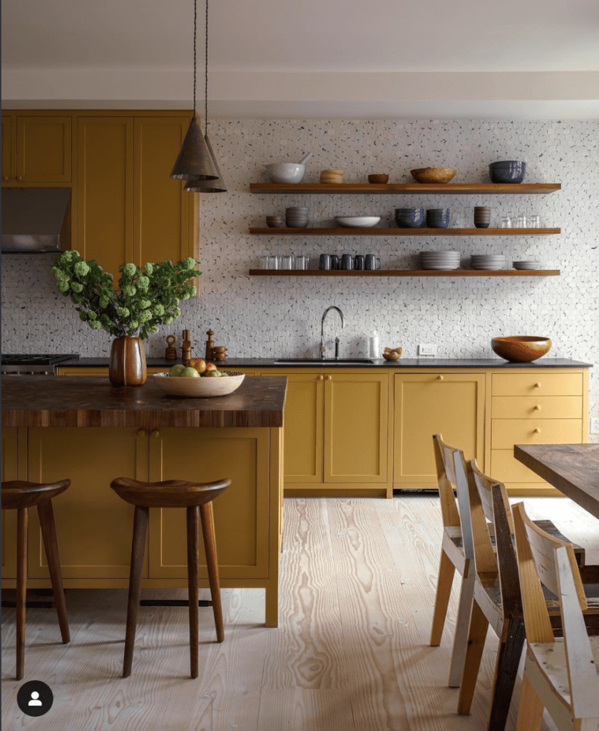 yellow painted kitchen cabinets. bold cabinet color can make your kitchen look more expensive