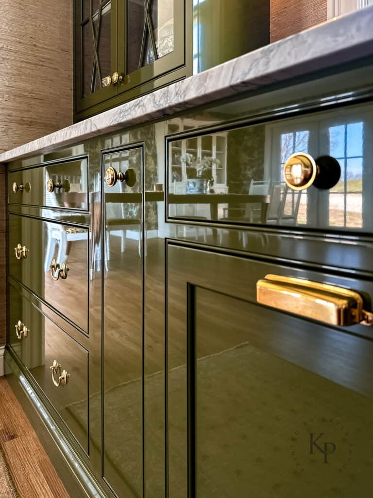 fine paints of europe hollandlac brilliant kitchen cabinets. dark green cabinets with brass hardware. high gloss lacquer on cabinets
